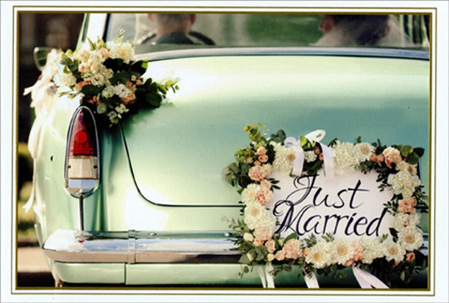 Wedding car decoration with glitter foil 'Just Married' outside text and inside message wishing a long journey together.