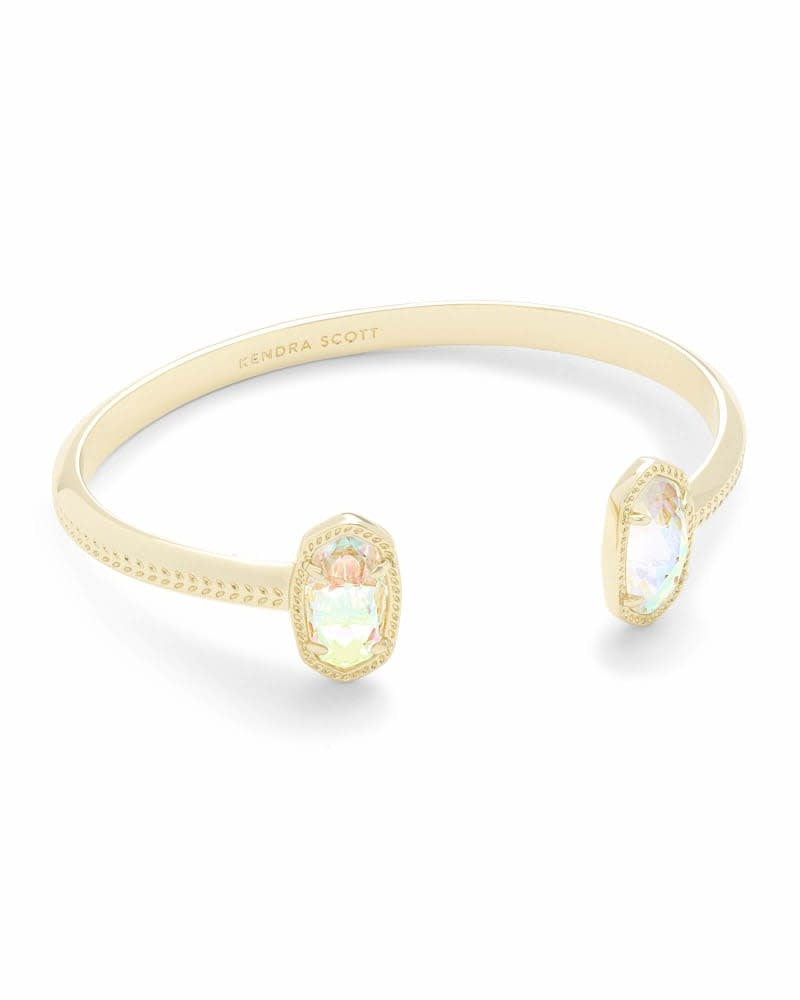 Gold open cuff bracelet with adjustable closure featuring dichroic glass accents.
