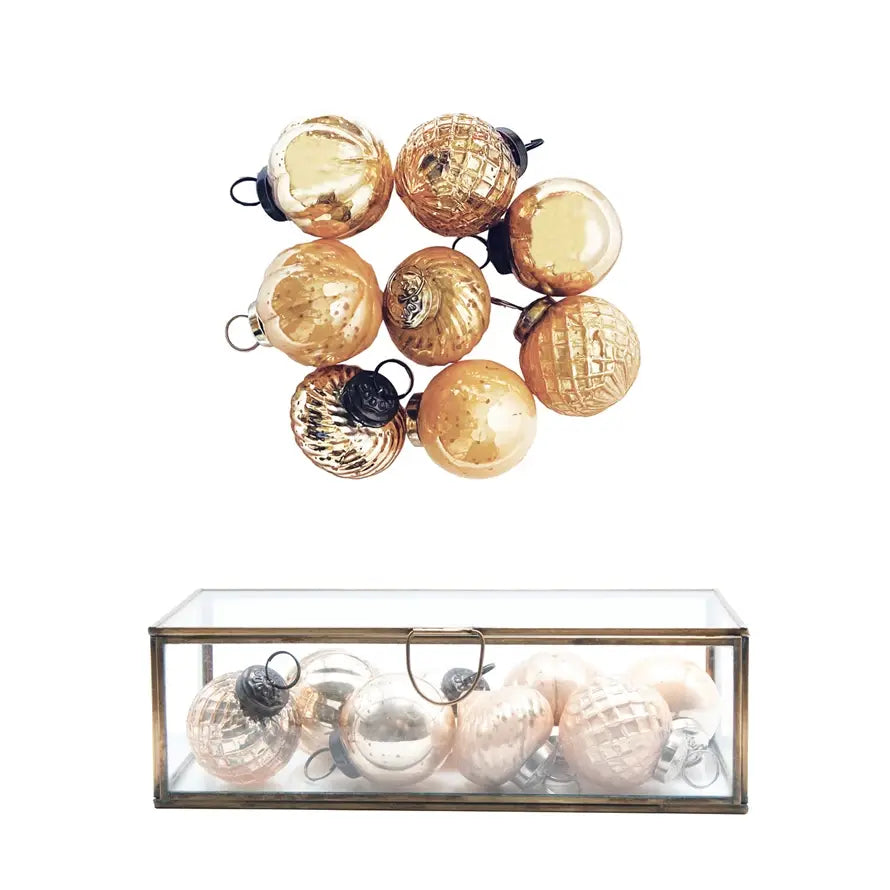 Set of embossed mercury glass ornaments with vintage finish and intricate textures.