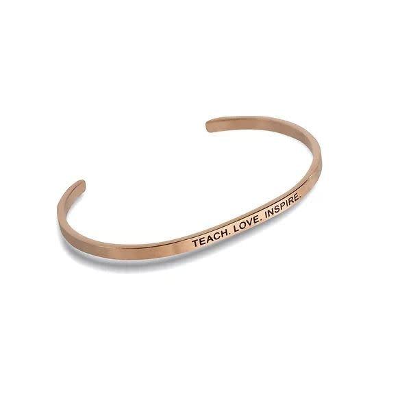 Rose gold Embracelets bracelet with 'Teach Love Inspire' text on a thin chain.