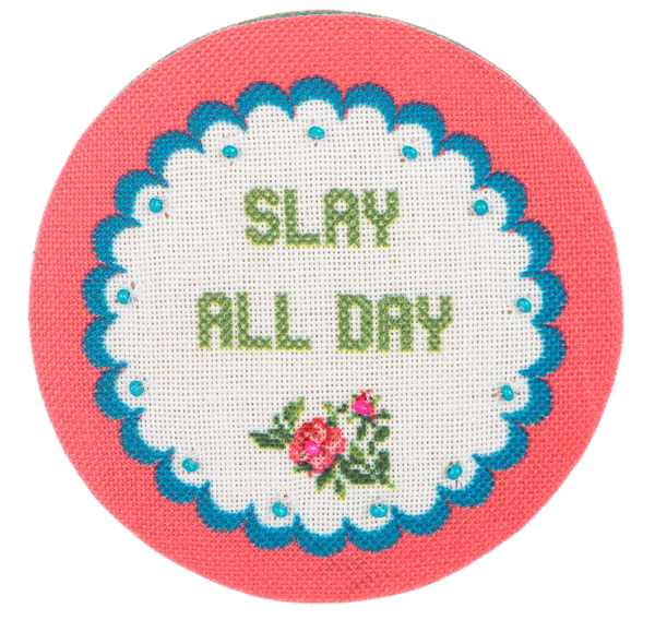 Multi-colored embroidered compact mirror with a cheeky chic travel case.