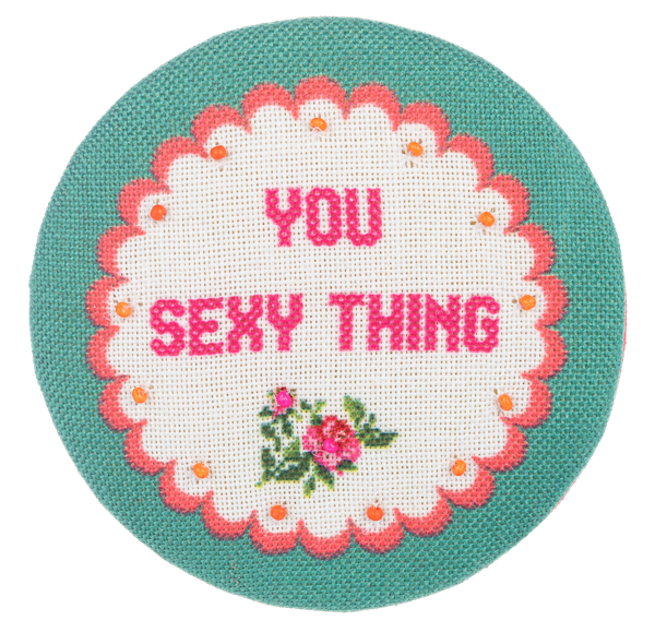 Multi-colored embroidered compact mirror with a chevron pattern on the lid.