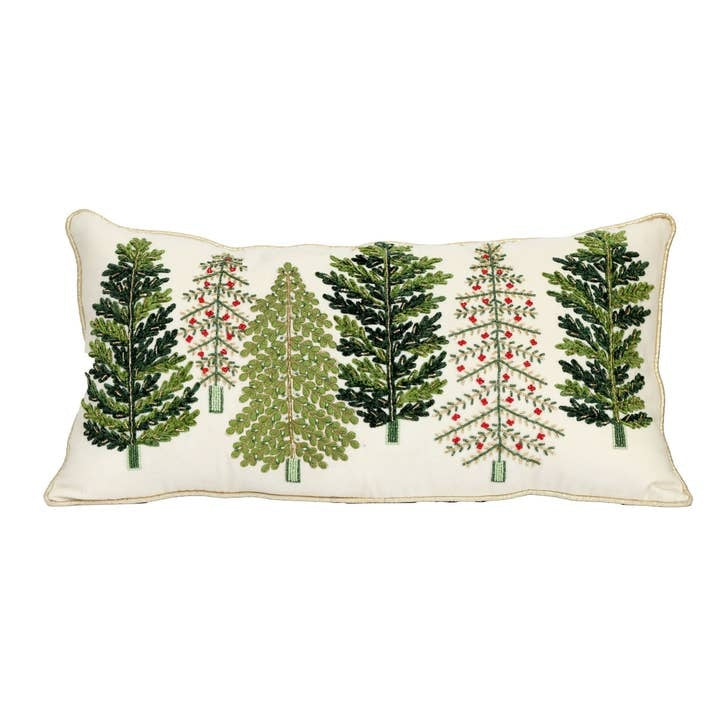Oblong embroidered pillow featuring green pine trees with red berry accents on a festive background.