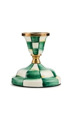 Emerald green checkered steel short candlestick with brass accents on a tabletop.