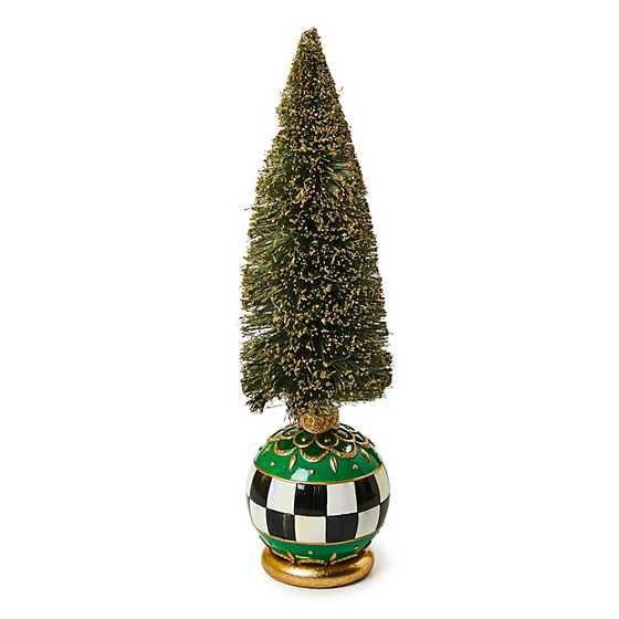 Emerald green bottle brush tree with gold glitter dusting in an ornament base featuring Courtly patterns and emerald accents.