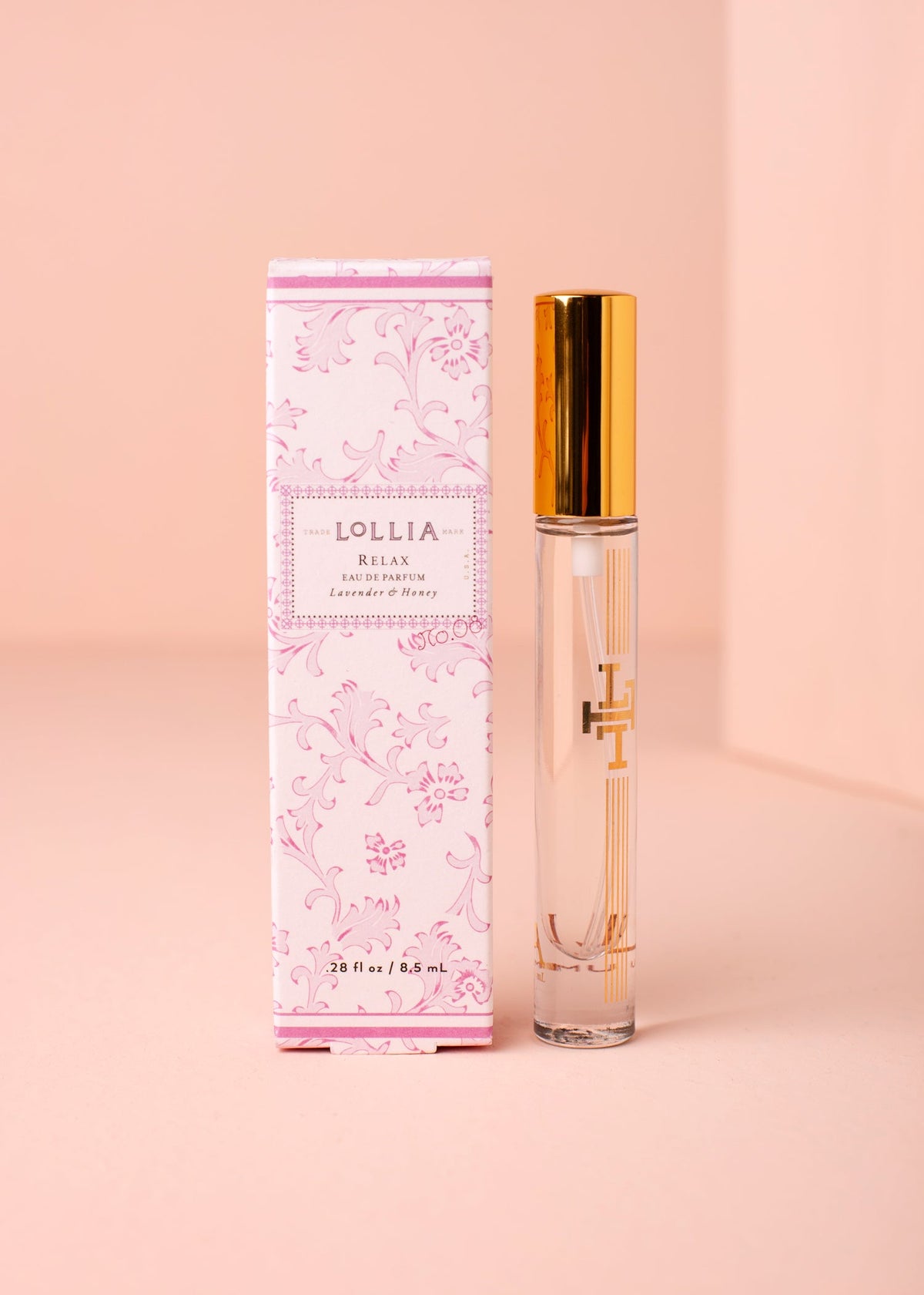 Travel Eau de Parfum in a gold-accented glass atomizer with gilded box.