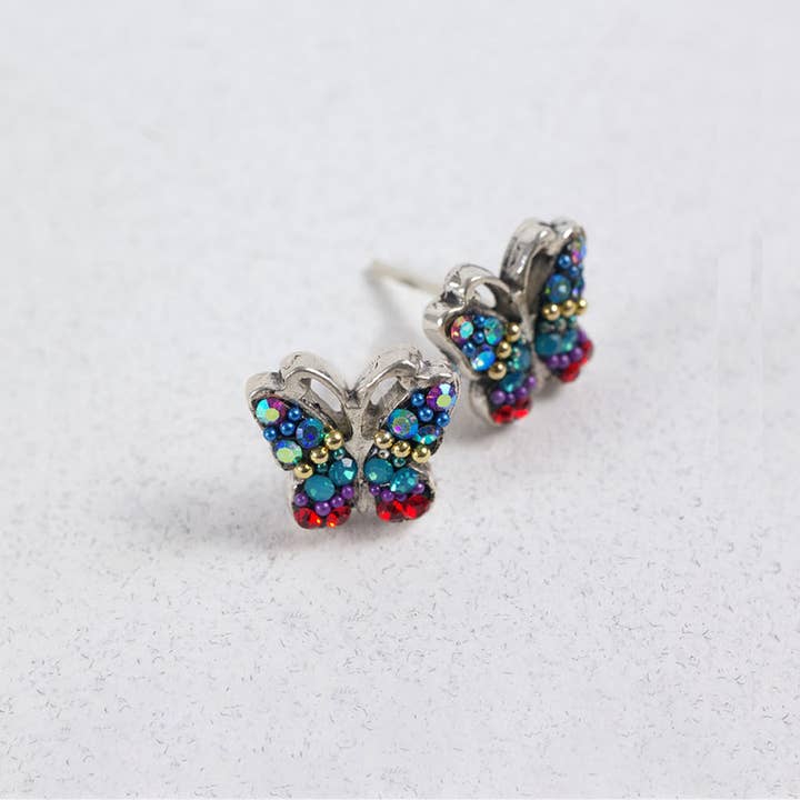 Sterling silver butterfly stud earrings featuring Austrian crystals in a delicate wing pattern.