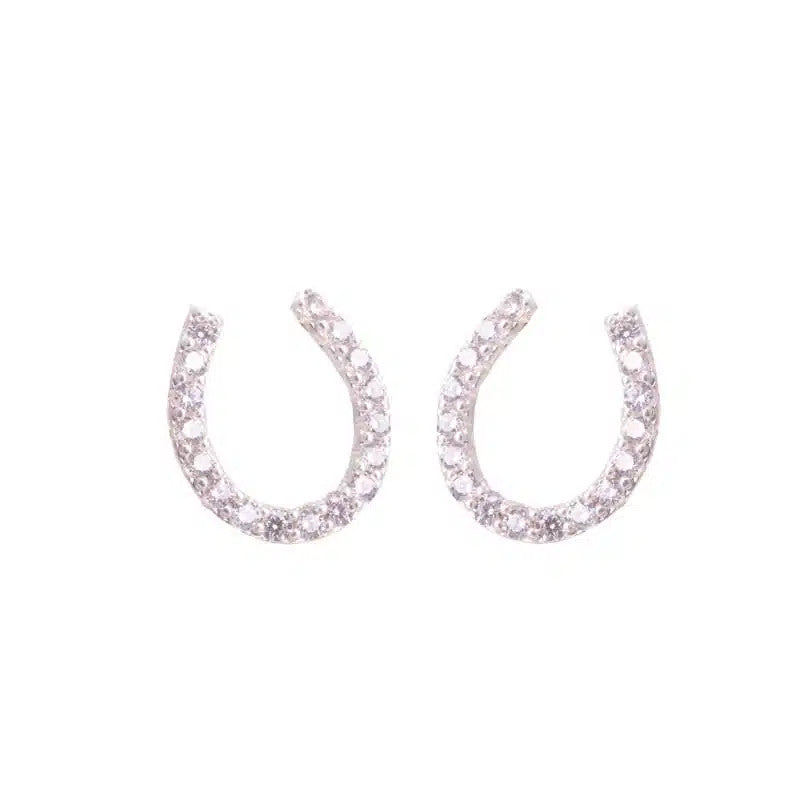 A pair of silver horseshoe-shaped stud earrings embellished with small clear crystals.