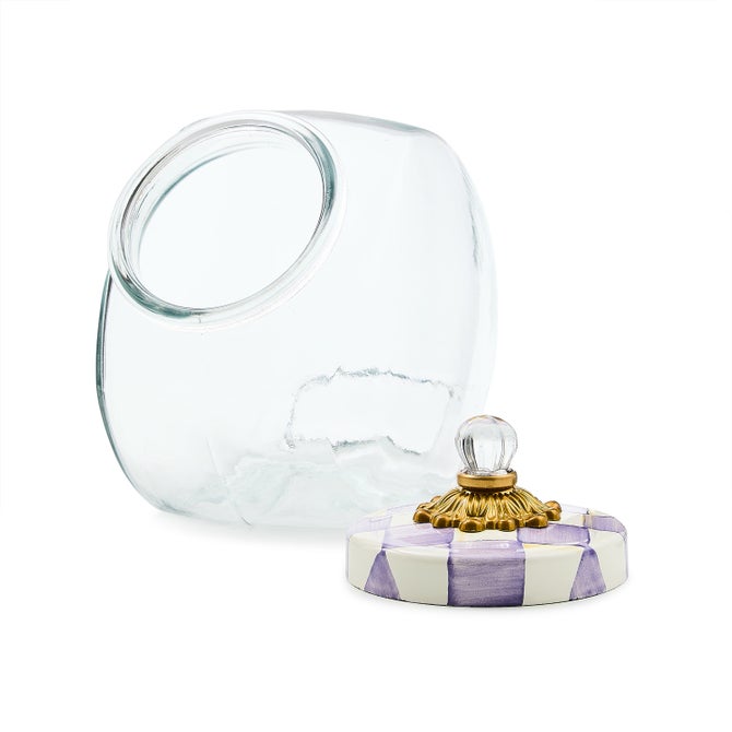 Ceramic cookie jar with violet checkered lid, white body, cylindrical silhouette.