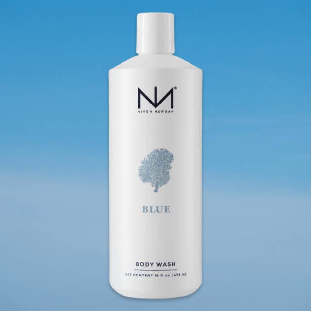 A 16 fl oz white bottle of Niven Morgan Blue Body Wash against a blue gradient background.