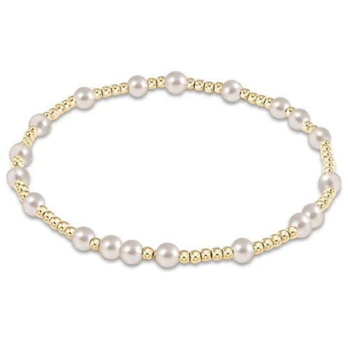 Extends Hope Unwritten bracelet featuring 4mm pearls and 2mm gold-filled beads on elastic cord.