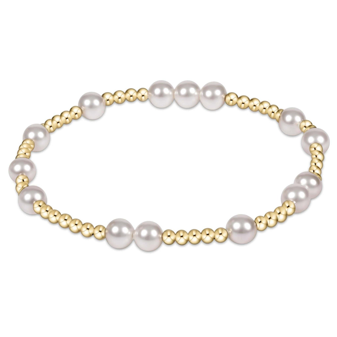 Enewton Hope Unwritten bracelet featuring a stretchy elastic band with alternating 6mm pearls and 2mm gold-filled beads.