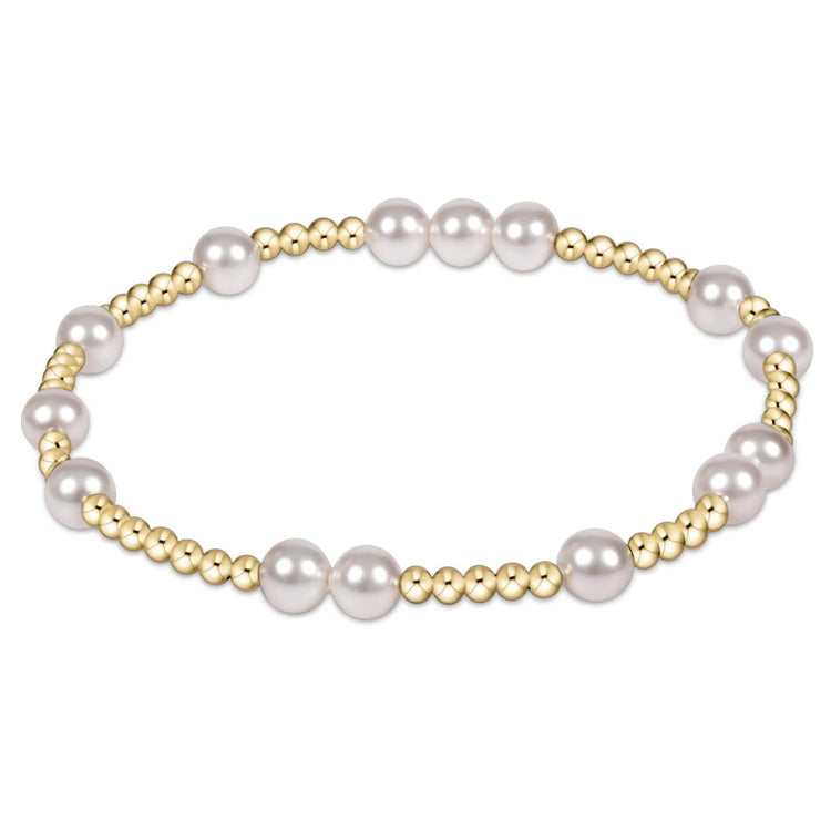 Enewton Hope Unwritten bracelet featuring a stretchy elastic band with alternating 6mm pearls and 2mm gold-filled beads.