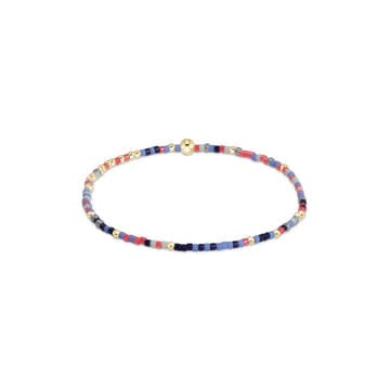 Enewton Hope Unwritten bracelet with random seed beads in Holy Crab colors on elastic cord.