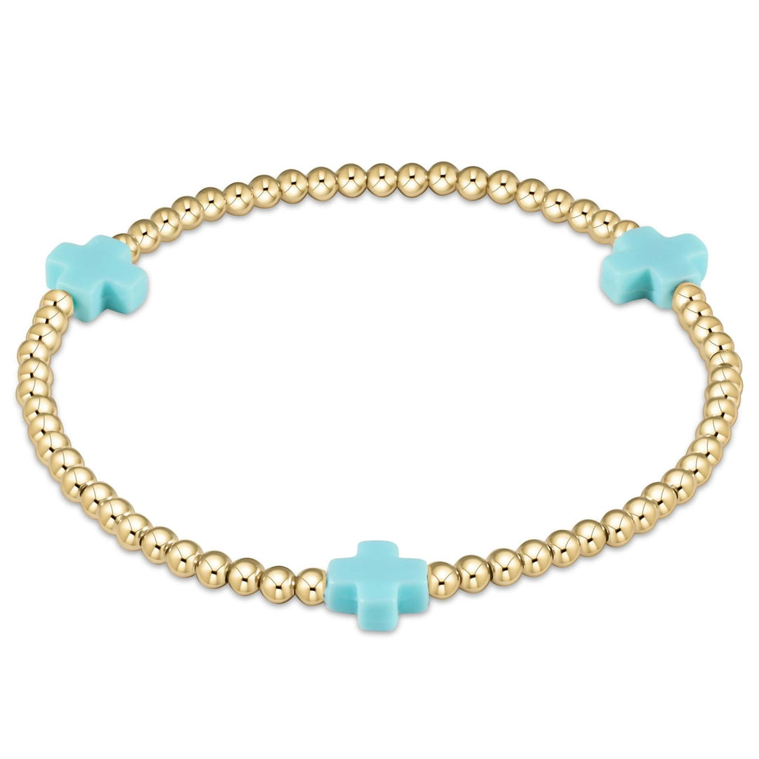 Enewton bracelet with gold-filled beads in a signature cross pattern on elastic cord