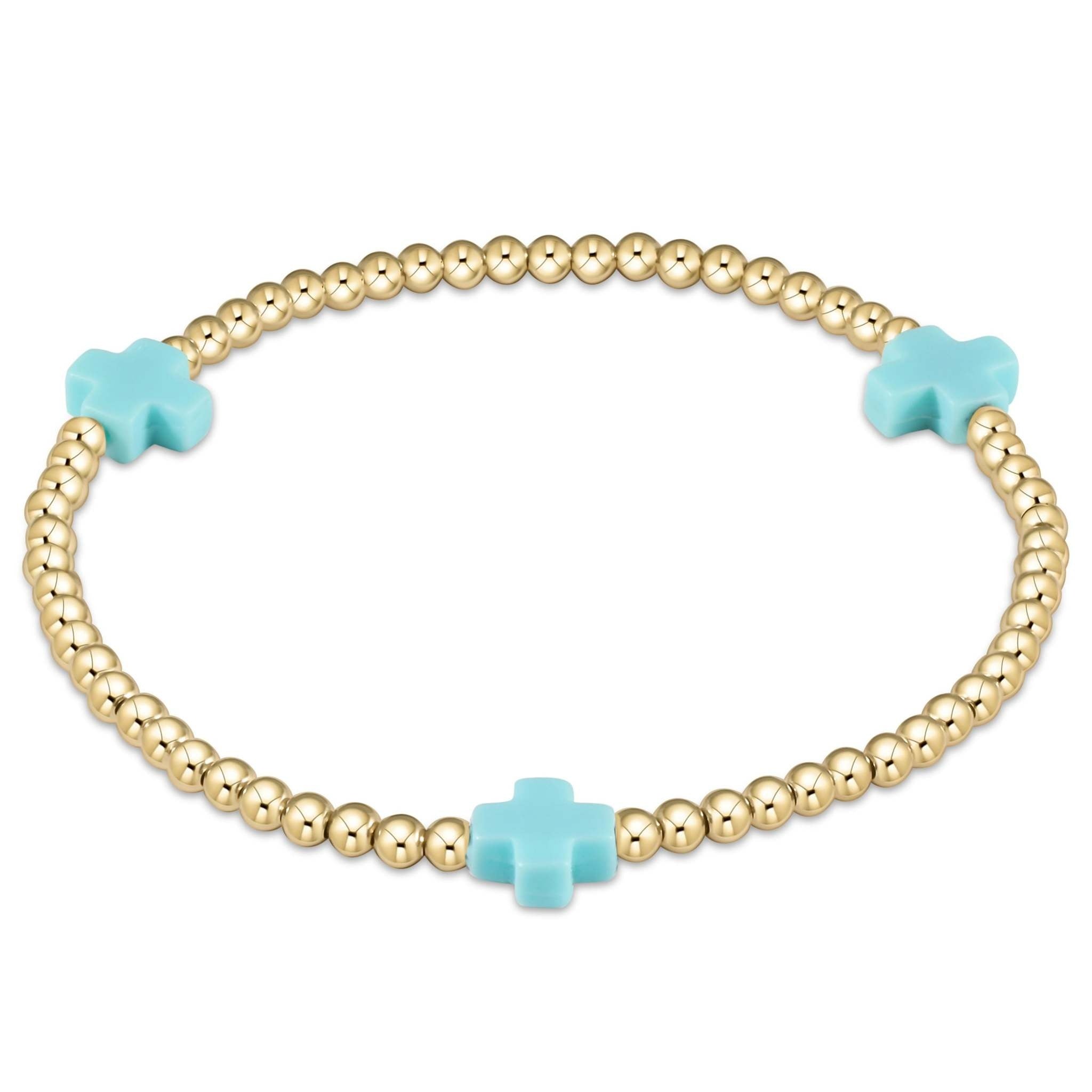 Enewton bracelet with gold-filled beads in a signature cross pattern on elastic cord