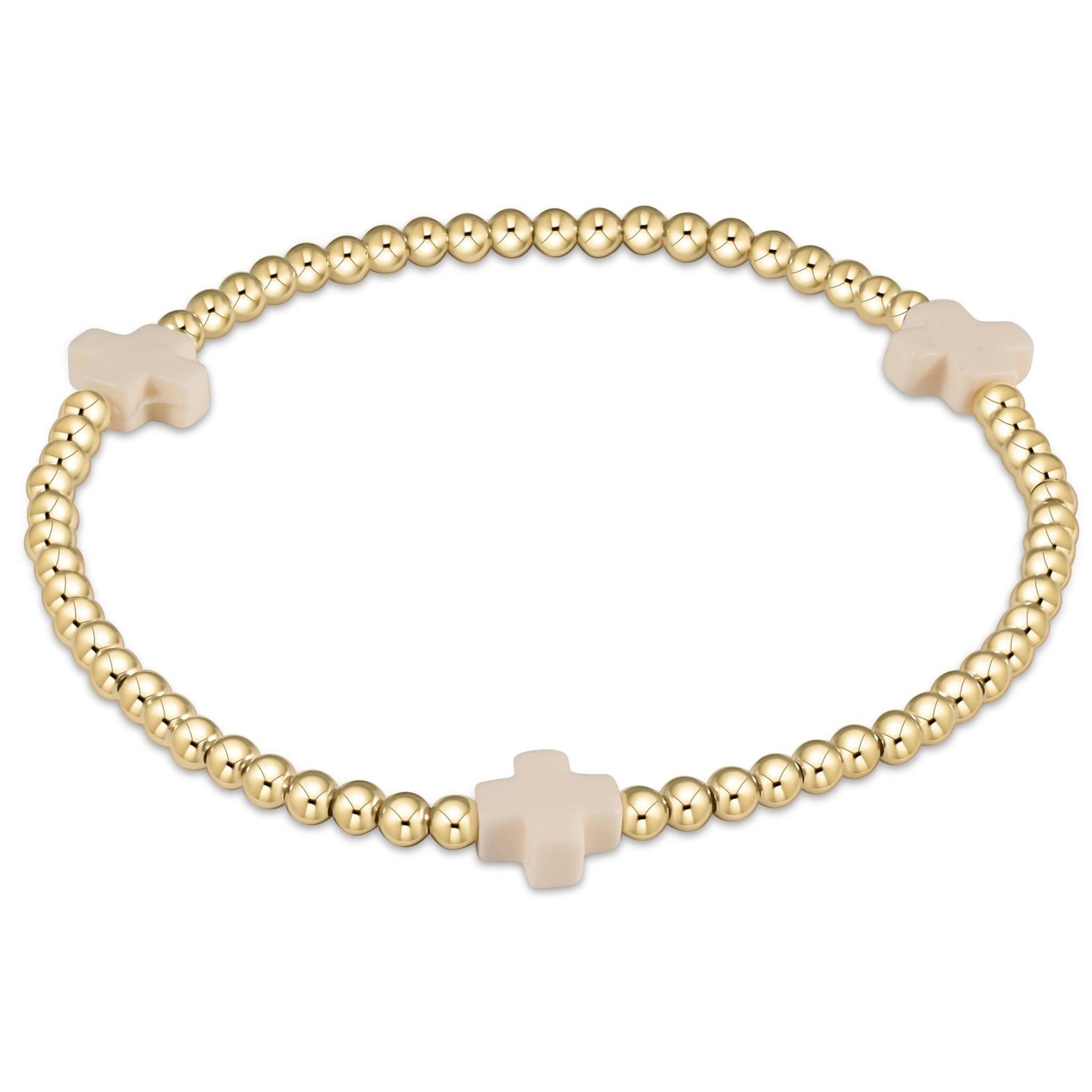 Enewton bracelet with gold-filled beads in a signature cross pattern on high-performance elastic.