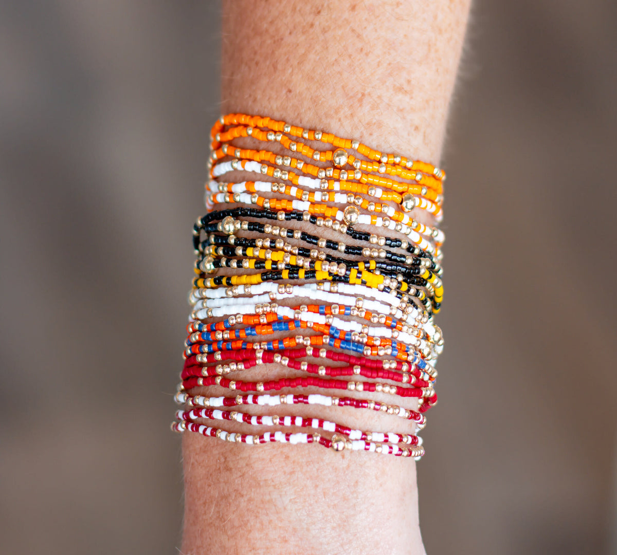 Gameday Hope Unwritten bracelet featuring multicolor seed beads with gold accents on stretch elastic.