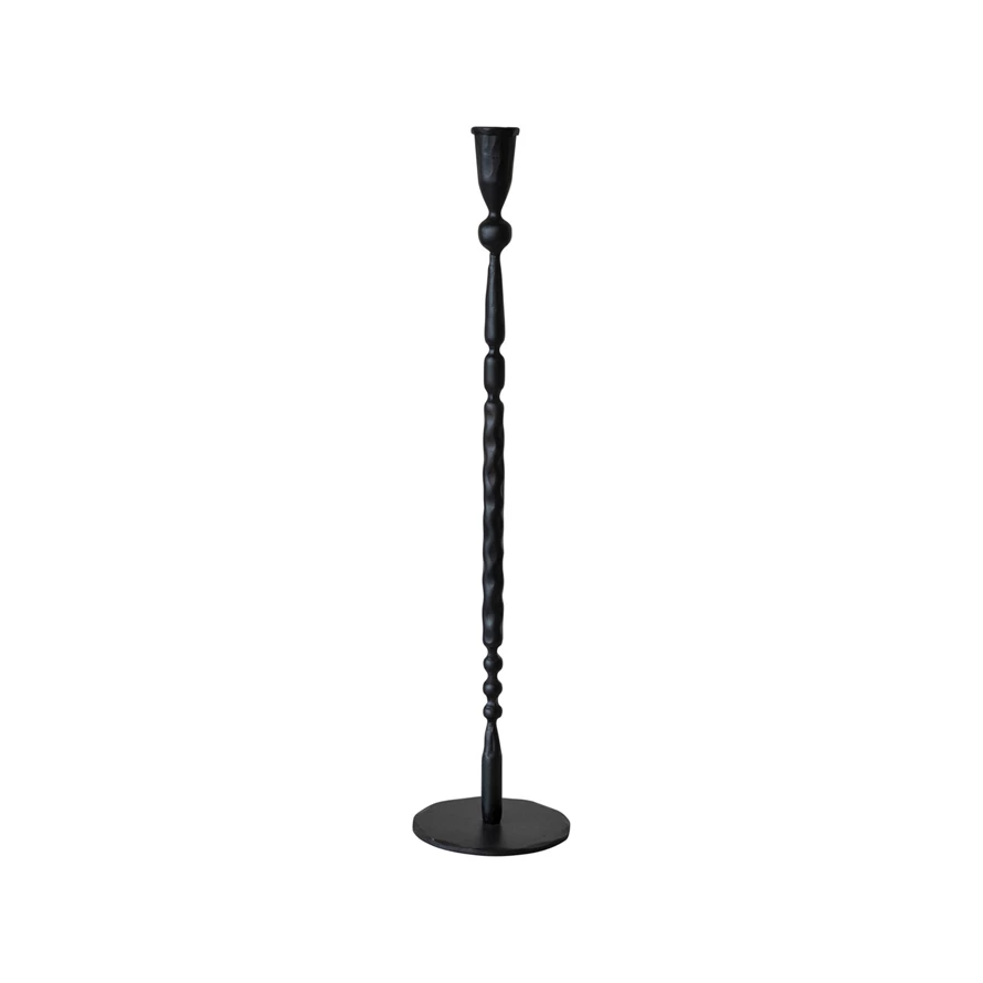 Hand-forged black cast iron taper candle holder with a textured, slender stem and round base.