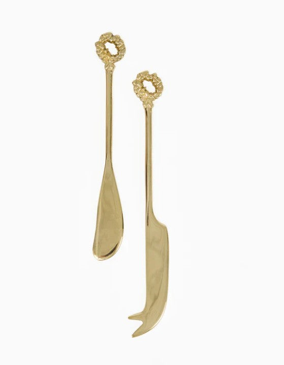 Set of two aluminum cheese knives with a brushed finish on a backer card.