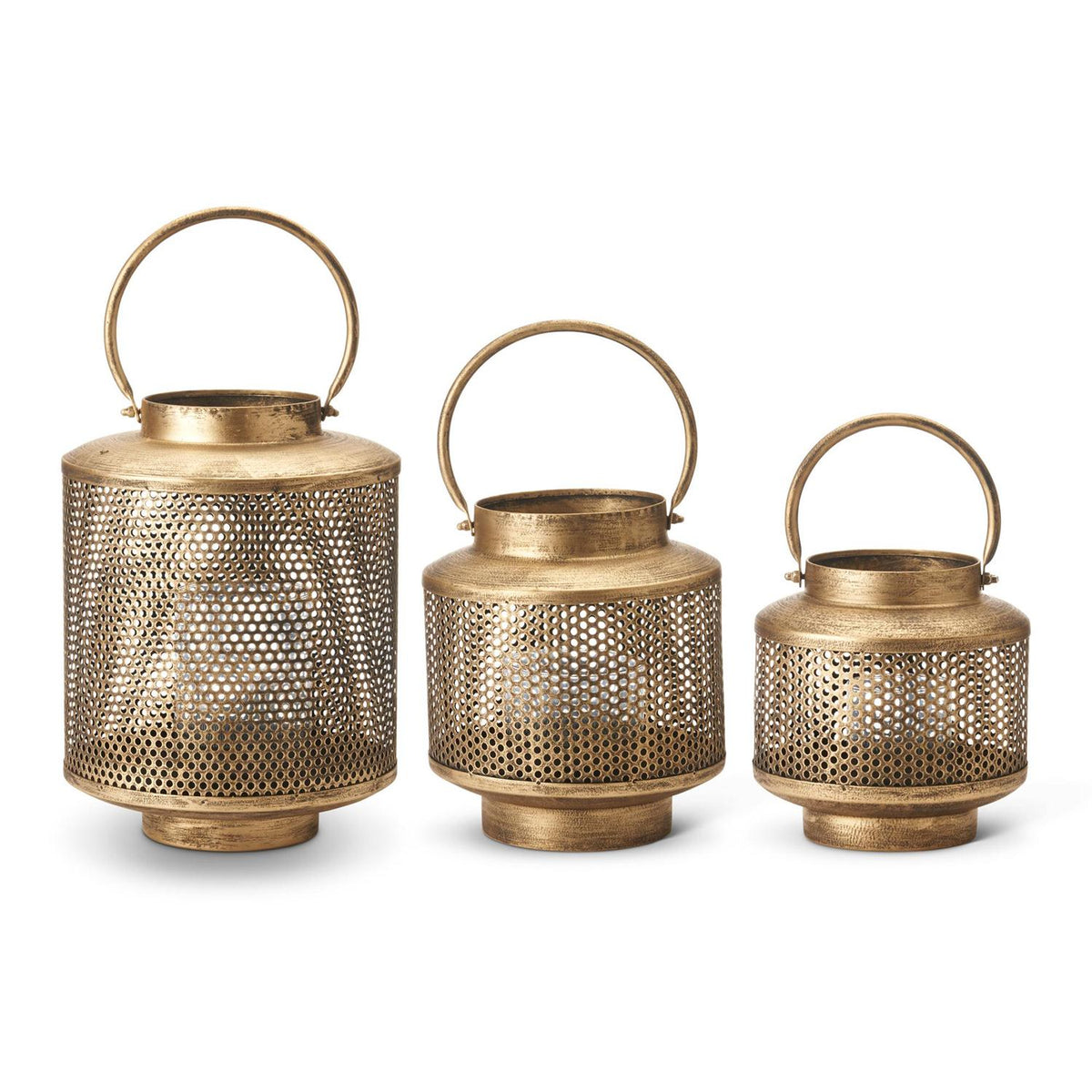 Set of three gold metal mesh lanterns in varying sizes with glass hurricanes and round handles.