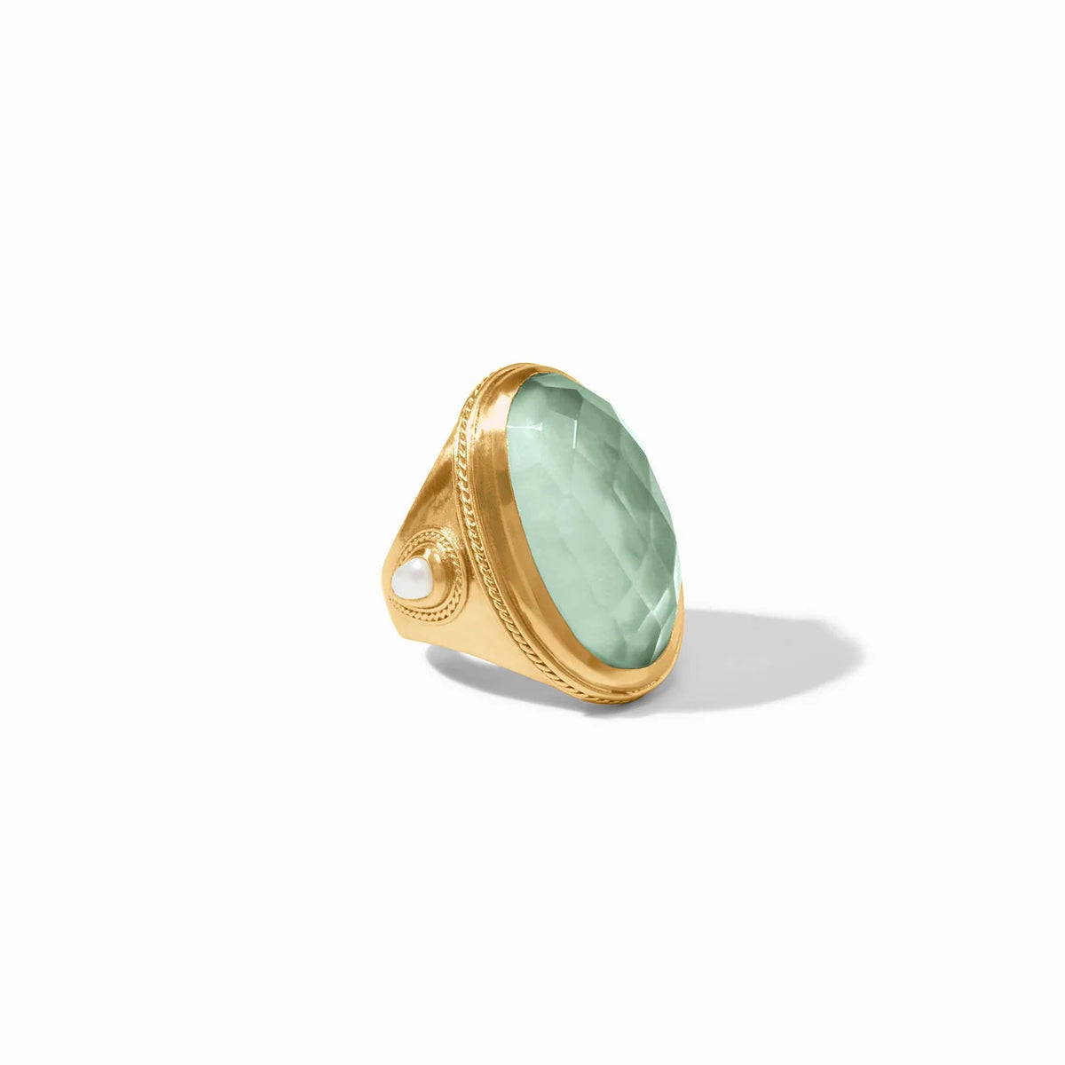 Gold-plated Cannes statement ring featuring a pear-shaped gemstone with mother-of-pearl accents and twisted wire detail.