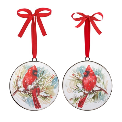 Iron ornament shaped like a cardinal perched on pine branches.