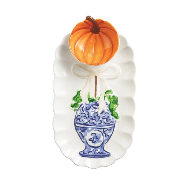 White scalloped tray with a blue and white ginger jar design and a removable orange pumpkin bowl.