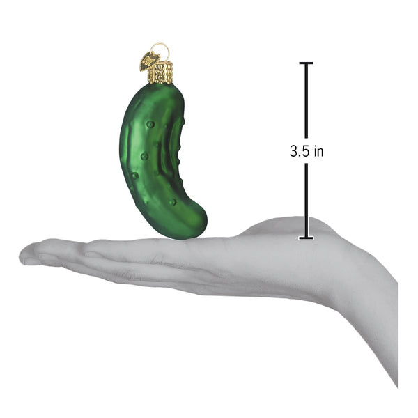 Green glass pickle ornament, 3.5 inches tall, shown in a hand for scale.
