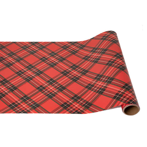 A roll of red plaid paper runner with a classic tartan pattern in red, black, and white.