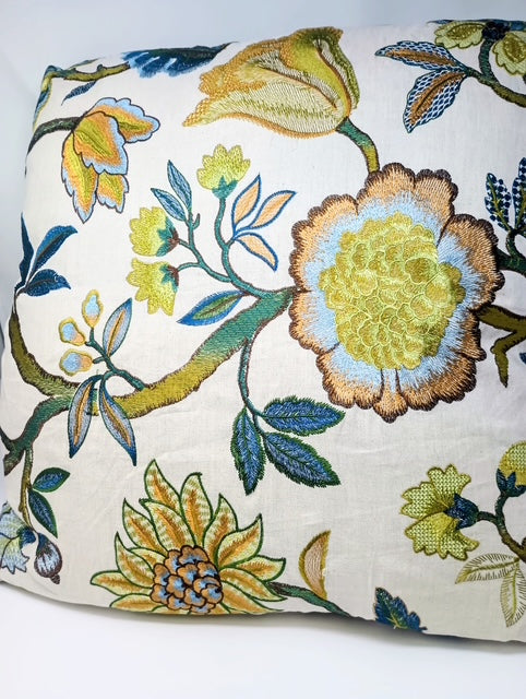 24 x 24 hand-crafted pillow with embroidered floral pattern in yellow, blue, and green.