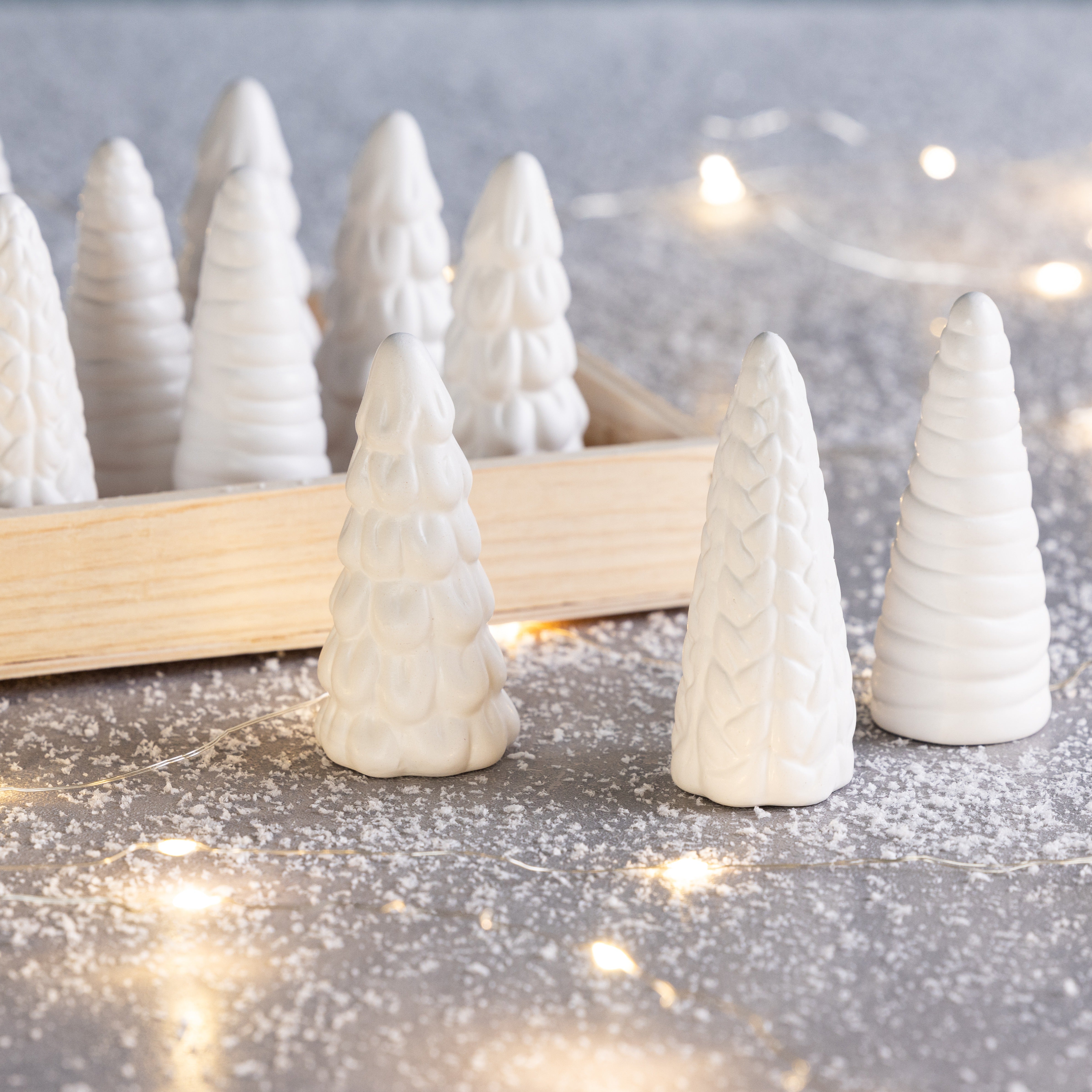 Mini Dol White Tree: a white dolomite decorative tree sculpture measuring 3.75 by 3.75 inches square and 7.75 inches tall.