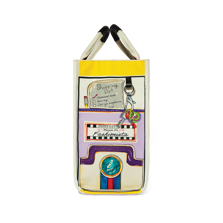 Side view of a large canvas tote with colorful travel-themed artwork and a shopping list design.