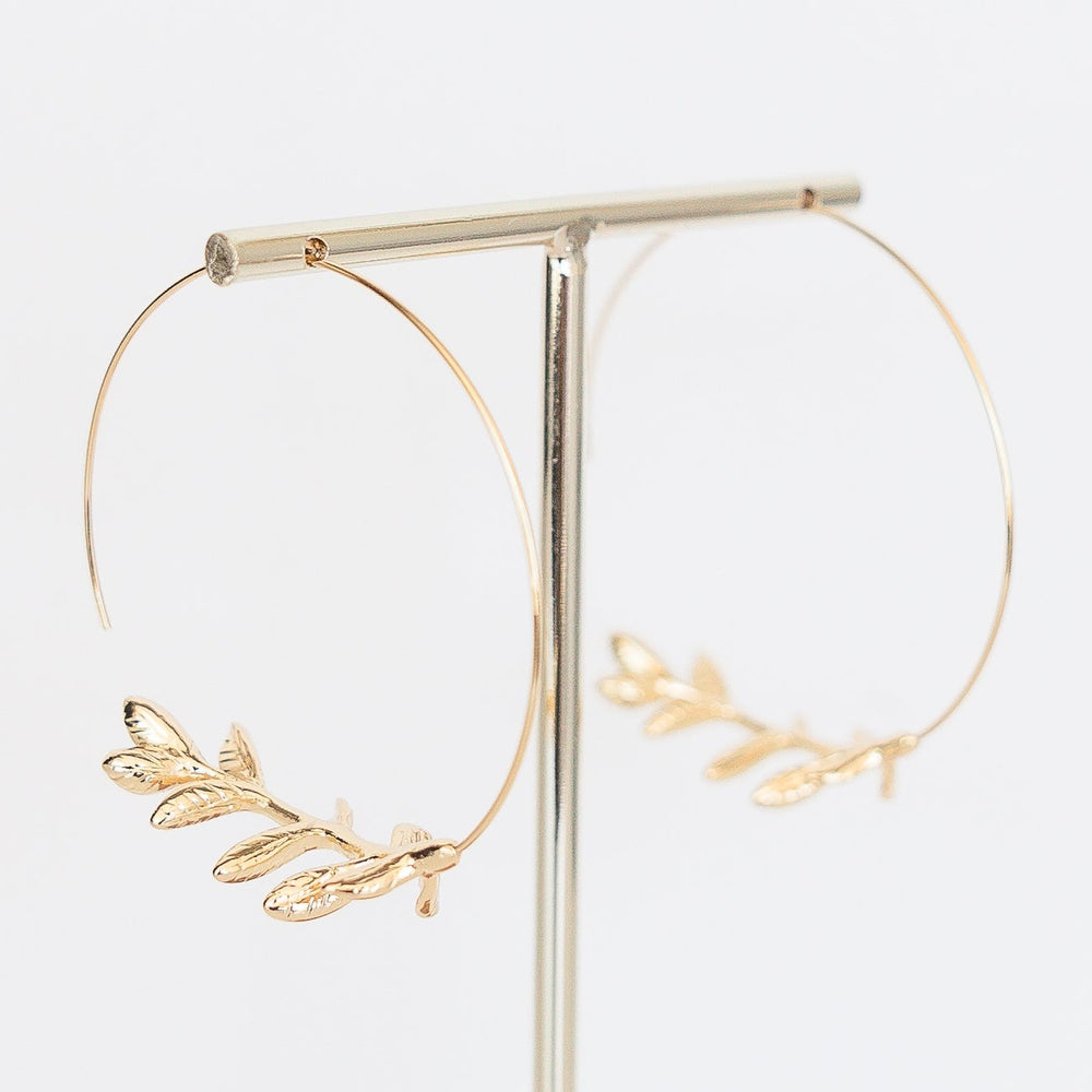 Silver-toned 2-inch hoop earring with leaf detail