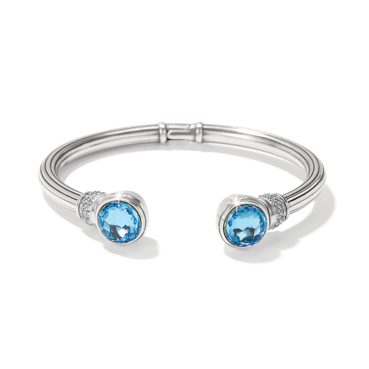 Silver hinged bangle with European crystals in a golden shadow hue capped with pave stones