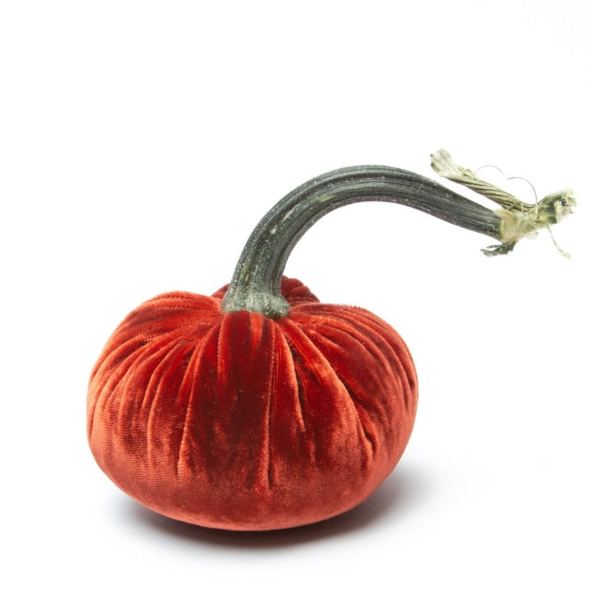 Handmade velvet pumpkin in deep orange with a natural stem.