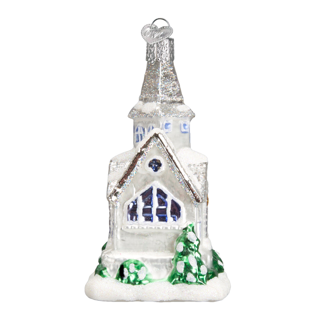 Sparkling glass cathedral ornament with white glitter snow, blue windows, and green pine trees.