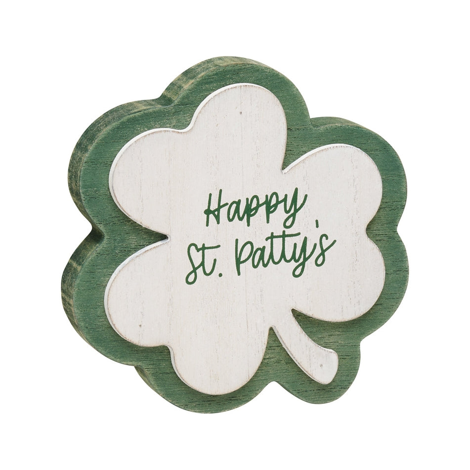 Green washed wood clover cutout with white text reading Happy St Patty's Day