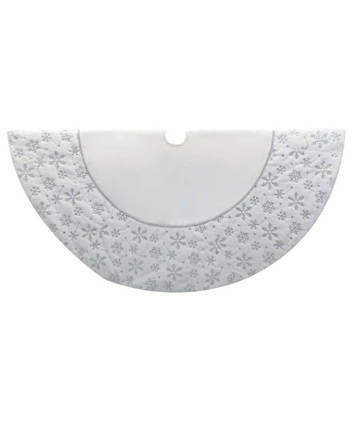 54-inch white velvet Christmas tree skirt with silver embroidered snowflake pattern and trim.