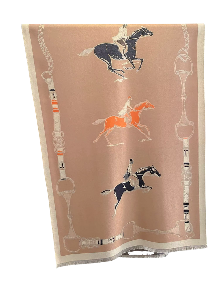 Reversible pink wrap with equestrian motifs featuring three riders on horses and bit-link borders.