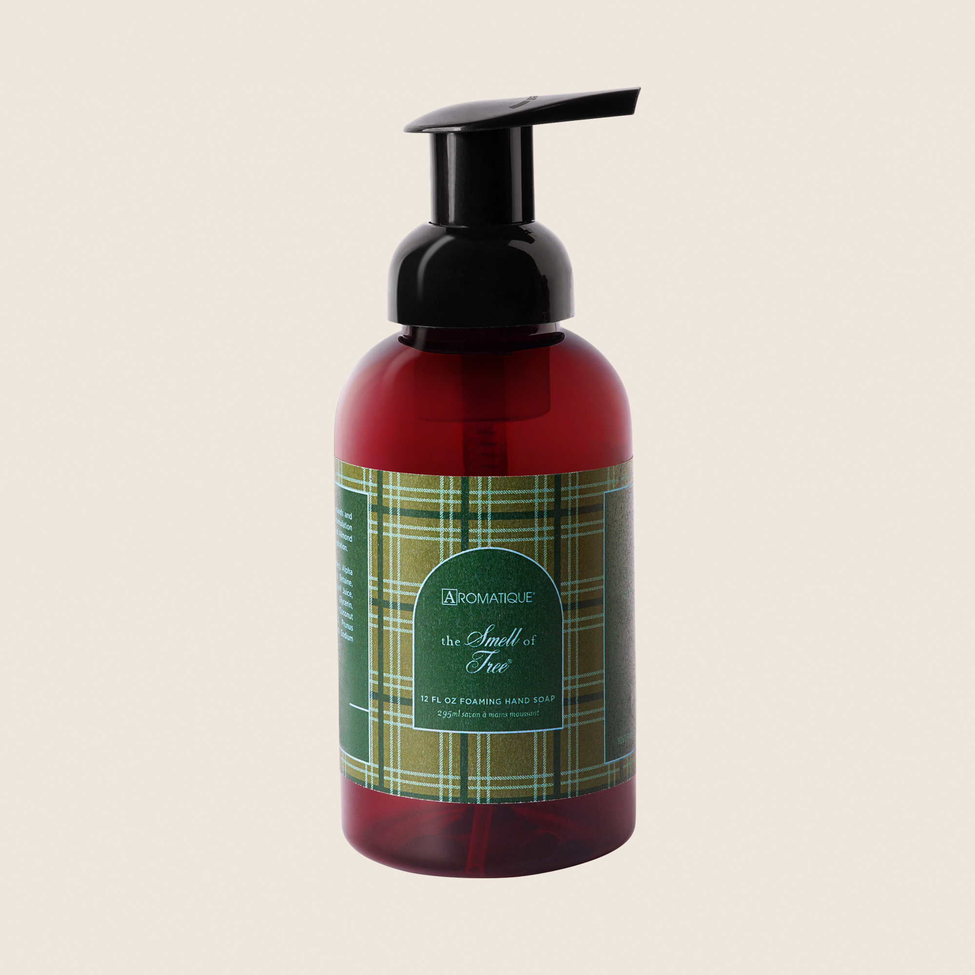 The Smell of Tree Foaming Hand Soap in a brown bottle with a green plaid label and black pump.