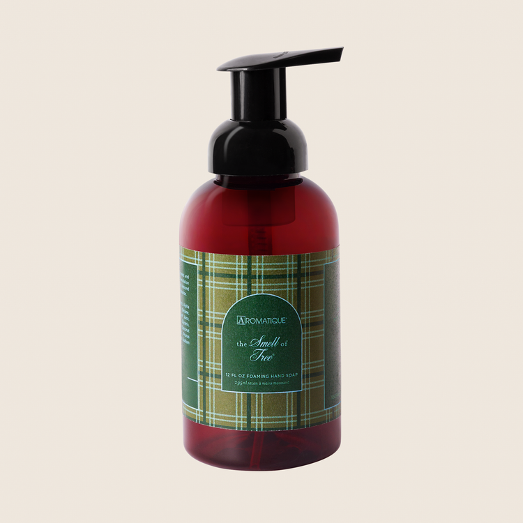 The Smell of Tree Foaming Hand Soap in a brown bottle with a green plaid label and black pump.
