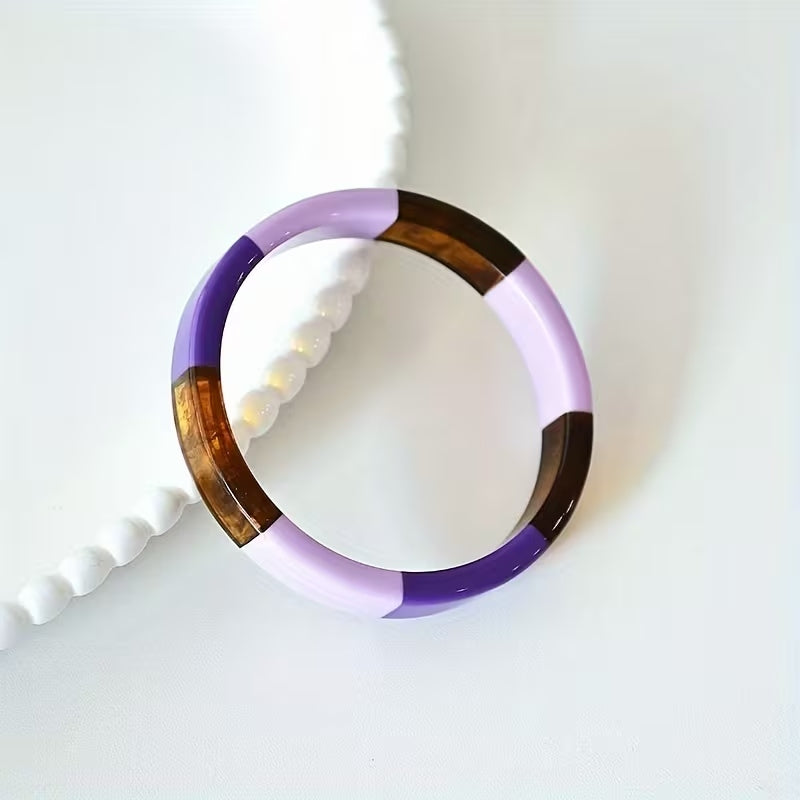 Patchwork tempered bangle bracelet with alternating purple, lavender, and amber resin segments.
