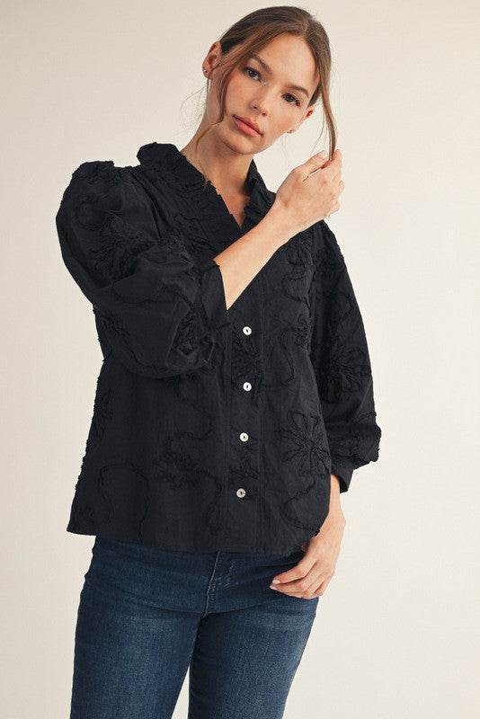Madeline button-down top in white cotton with a three-dimensional floral pattern.