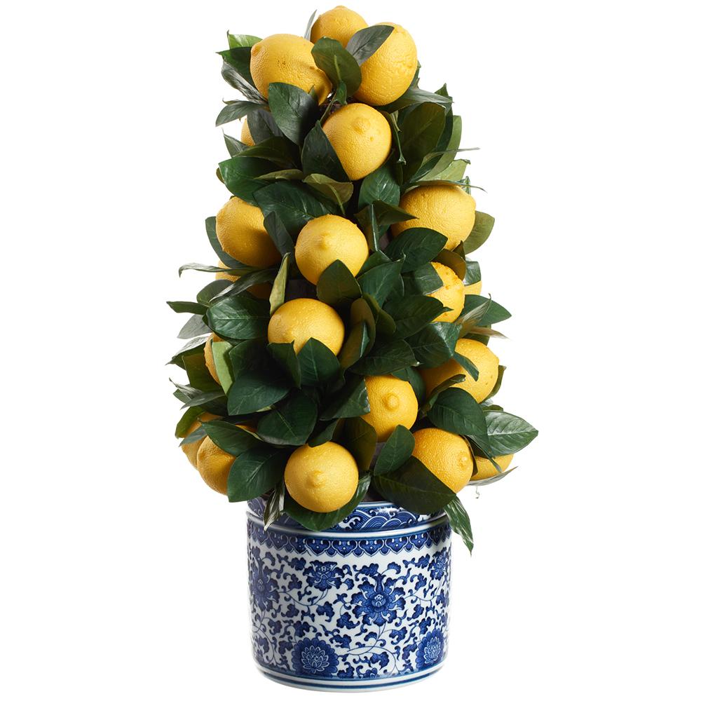 Ceramic vase holding a yellow artificial lemon tree with green leaves.