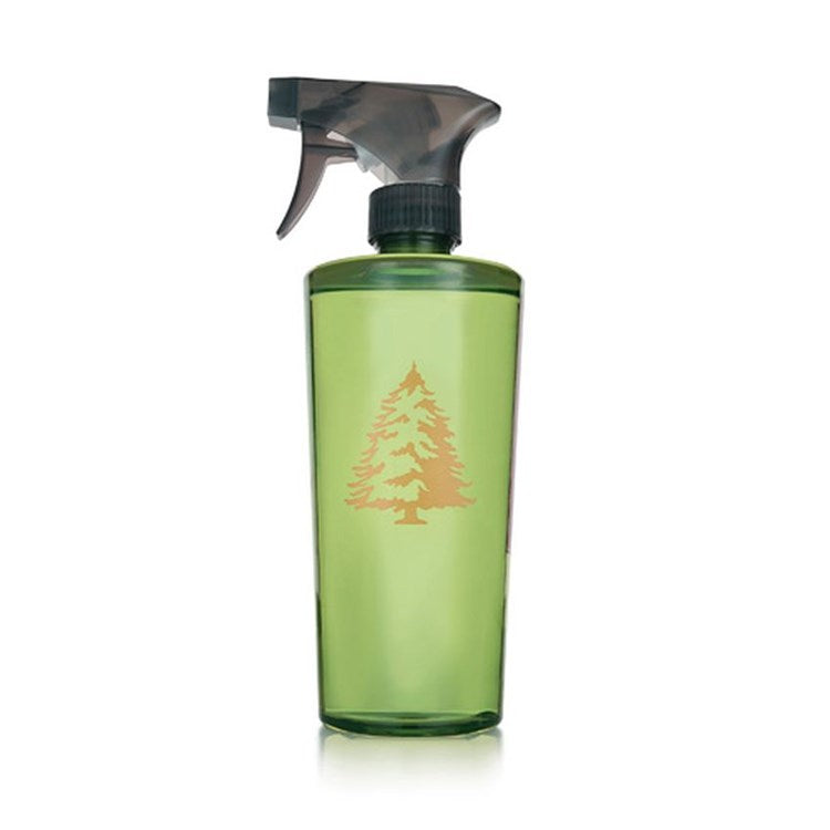 Frasier Fir Countertop Spray in a green translucent bottle with a gold pine tree logo.