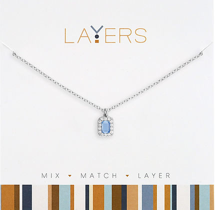 Silver stainless steel necklace with a light sapphire emerald cut pendant and halo setting.