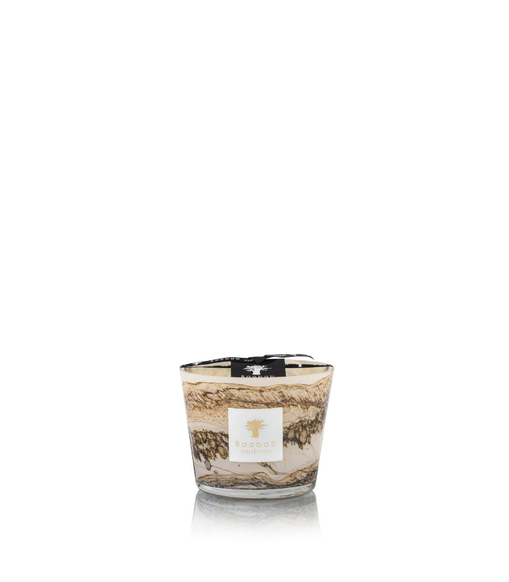 Baobab Collection Sand Siloli candle in a glass jar with a marbled brown and beige pattern.