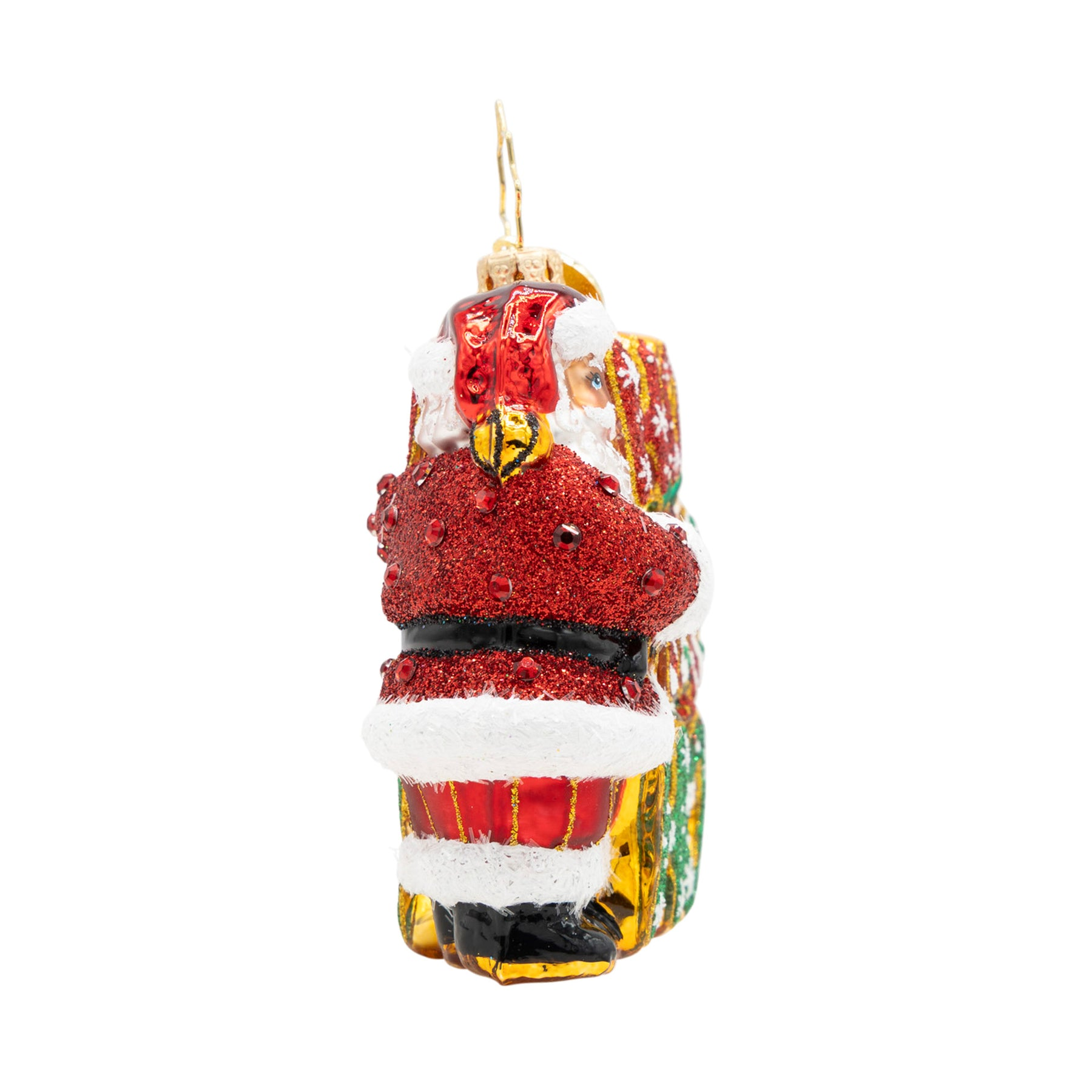 Back view of a glittery Santa Claus glass ornament holding a stack of colorful gift boxes.
