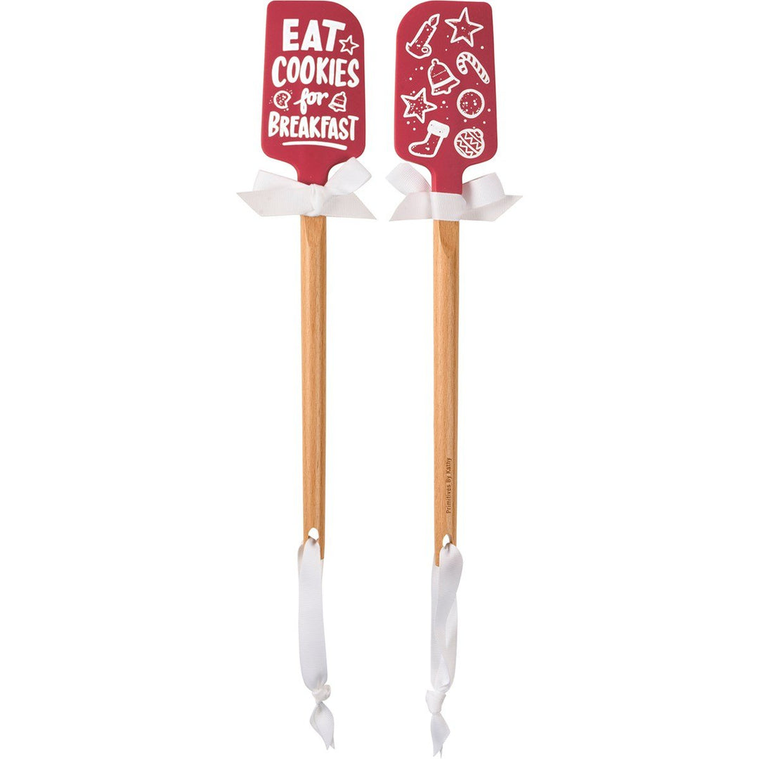 Wood-handled silicone spatula with red Christmas-themed head.